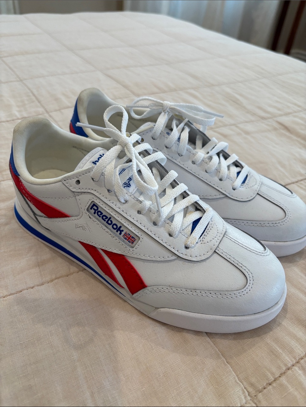 Reebok Women’s White Sneakers with Red and Blue Accents